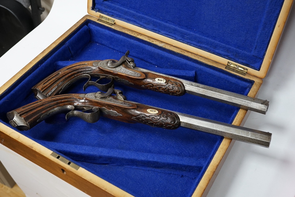 A pair of 40 bore percussion target pistols by Devisme of Paris, octagonal barrels cut with multi-groove rifling, engraved and signed locks, steel furniture ensuite, fluted walnut butts, half stocked, with gold inlaid nu